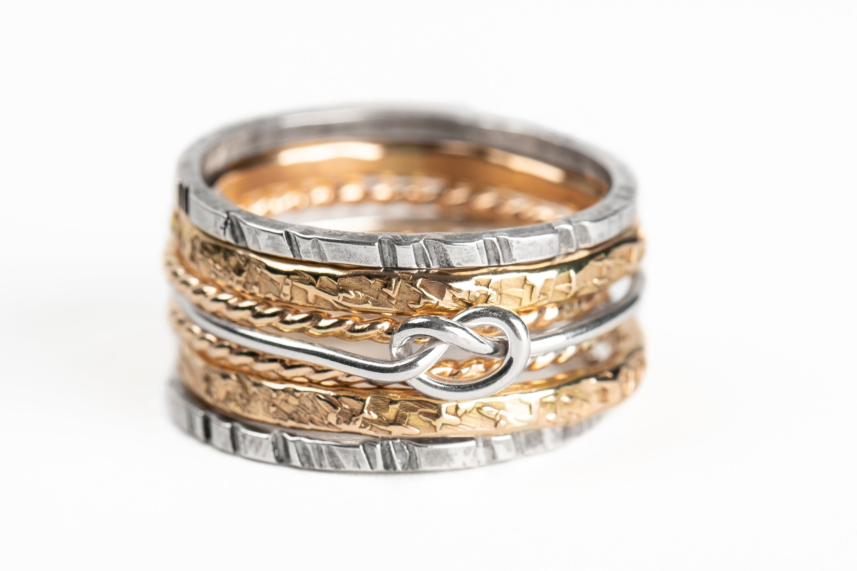Love Knot Mixed Metal Stacking Ring Set Of 7 | Sterling Silver and 14K Gold Fill Stack Stackable Knotted Tied Hammered Rings | Tie The Knot