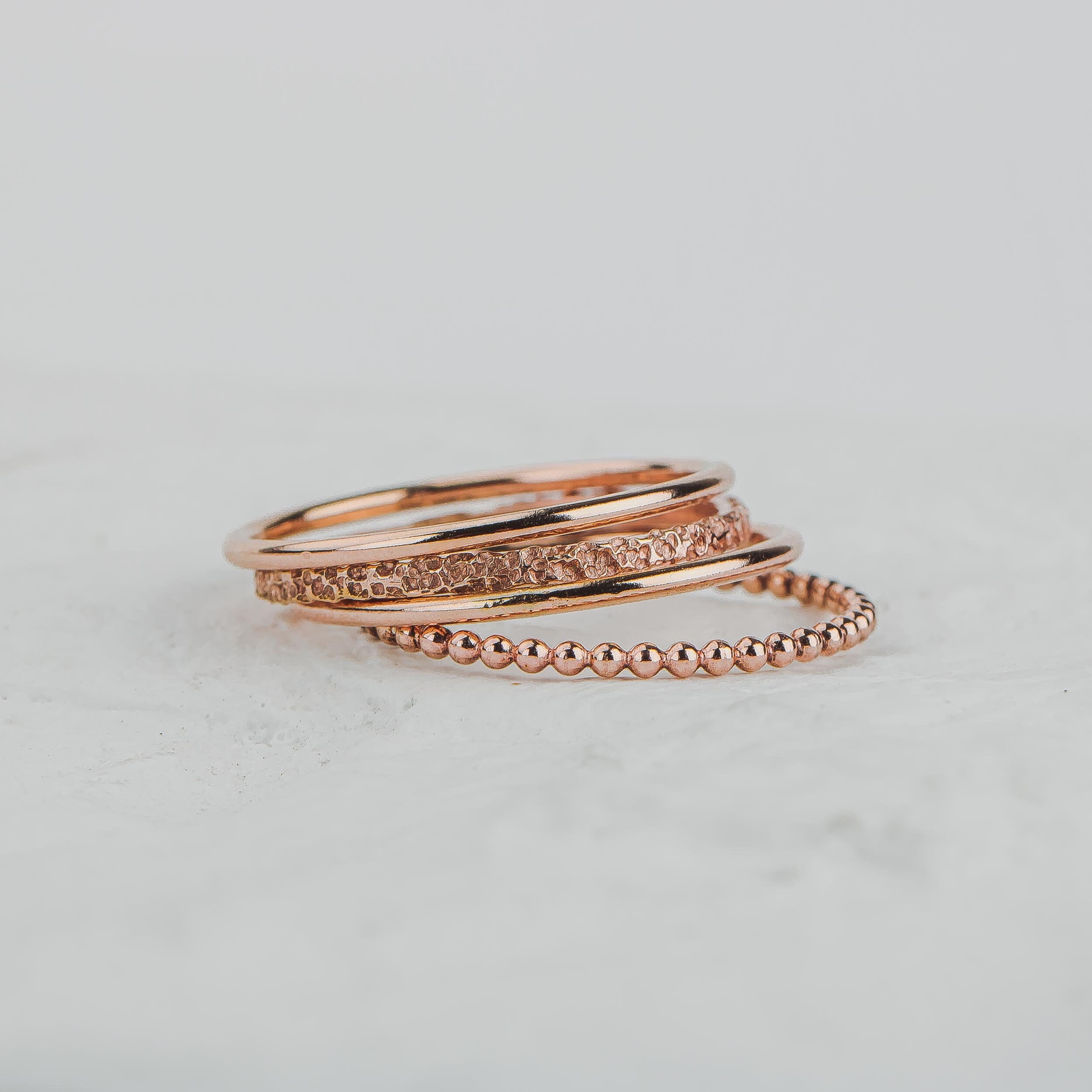 The Claire Stack | Set of 4 Stacking Rings | Smooth, Boulder, and Dot Stackable Stack Rings | Gold, Rose or Silver Mixed Hammered Ring Bands